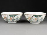pair of chinese famille bowls with figures on a landscape