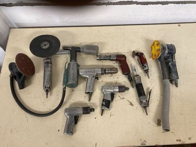 a lot of tools that are sitting on a table