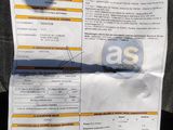 a picture of a receipt on the back of a car