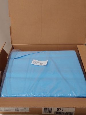 a box with a blue sheet in it on the floor