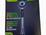 packaging of a razor on a white background with a black background