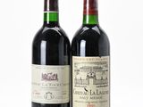 two bottles of wine sitting next to each other on a table