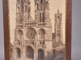 an old picture of a cathedral with a clock on the front