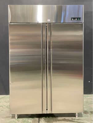 two stainless steel refrigerators sitting side by side