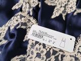a close up of a dress with a label on it
