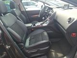 the interior of a car with black leather seats and a center console