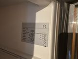 a white refrigerator with the door open in a kitchen