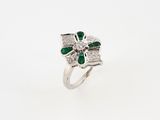 a white gold ring with emerald and diamonds