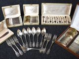 many different types of silverware in a case