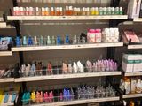 many bottles of nail polish on the shelves in the store
