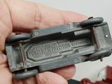 a person holding a small metal object in their hand