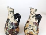two vases that are sitting on a table