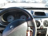 dashboard view of a car with a steering wheel and gauges