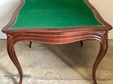 a small table with a green cloth on top of it