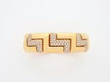 an 18k yellow gold ring set with diamonds