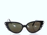 black cat eye sunglasses on a white background with reflection