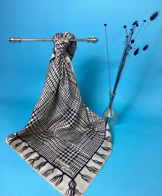 an image of a scarf hanging on a clothes rack