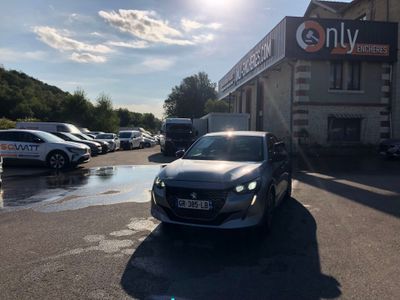 a car parked in a parking lot in front of a building
