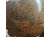 a large globe that is sitting on top of a table