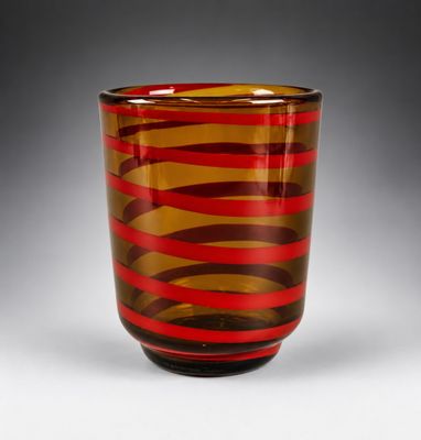 an image of a red and brown striped glass vase on a table