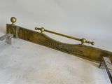 a metal bed frame with a wooden head board