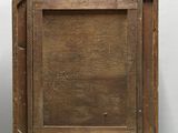 an old wooden box with a wooden frame on top of it