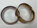 two rings that are sitting on a table