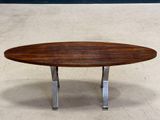 a close up of a table with a wooden top and metal legs