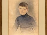 portrait of a young boy in a blue shirt