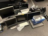 a lot of computers that are sitting on the floor
