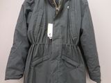 an image of a jacket hanging on a hanger on a wall