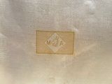 a close up of a white bag with a label on it