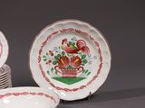 a stack of plates with a rooster design on them