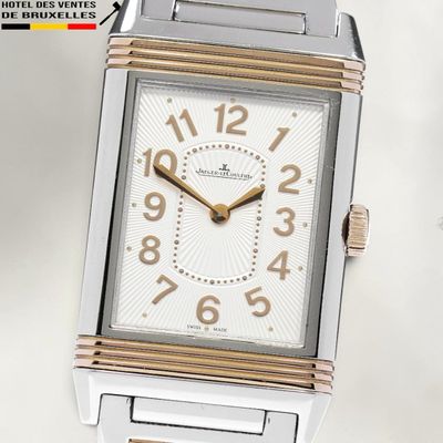 an image of a close up of a wrist watch on a white surface