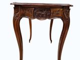 an image of a wooden table with a carved top on a white background