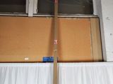 a wooden pole sticking out of a window in a room