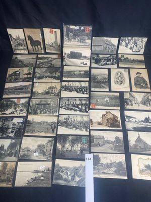 a lot of old black and white pictures on the table