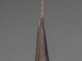 sculpture of a cone shaped object on a wooden base