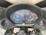 a close up of a motorcycle with a speedometer and gauges