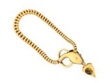 an image of a gold necklace with a green stone