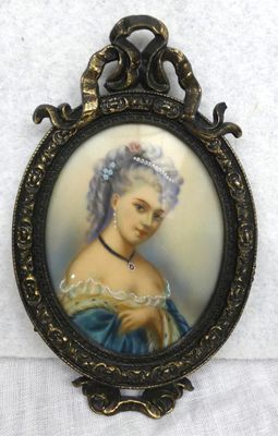 a close up of a picture of a woman in a blue dress