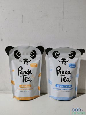 two bags of panda tea sitting next to each other on a table