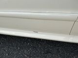 a picture of a car with a denting dent on the side of it