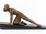 bronze statue of a man on a black base