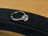 a ring that is sitting on top of a black case