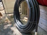 a hose that is sitting on the ground next to a building