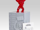 a close up of a statue of a man holding a red object