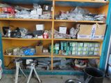 a shelf full of assorted items in a garage