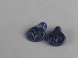 une paire de bouchons d'oreille en verre de la Rome antique