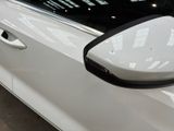a close up of a car door handle with a mirror on it